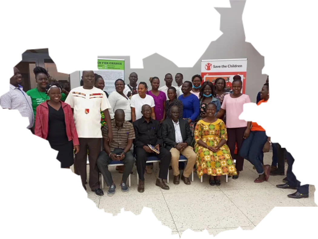 Women for Change staff and partners, pictured inside the outline of South Sudan